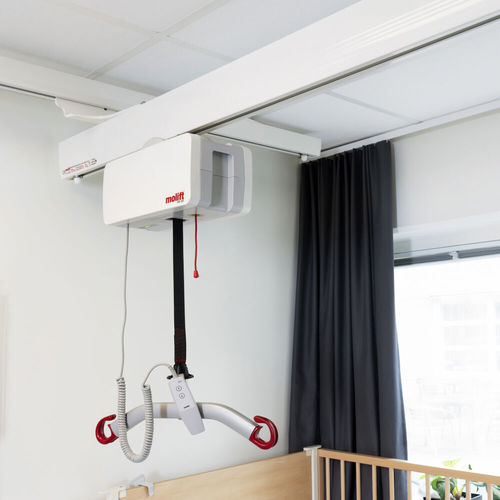 Elevador de pacientes eléctrico - Etac - de techo / en riel / para bañera