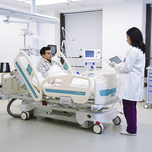 Cama de hospital - Jiangsu Saikang Medical Equipment - eléctrica / de altura regulable / con ruedas