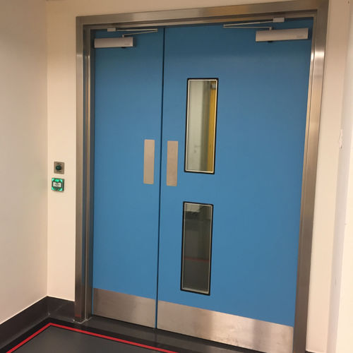 Puerta de protección - Dortek - para centro sanitario / corredera