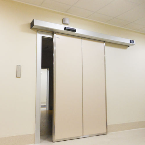 Puerta de protección radiológica - Anti-x - Cablas - para centro sanitario / corredera / de madera