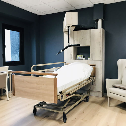 Elevador de pacientes eléctrico - Intégralift - SCEMED - de altura regulable / autoportante / en riel