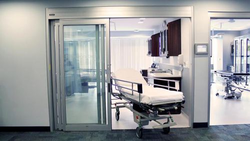 Puerta para cuidados intensivos - Dura-Care 7500A - Stanley Access Technologies - abatible / de vaivén / automática